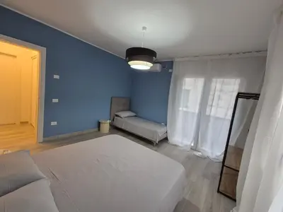 Letto o letti in una camera di Casa Anna