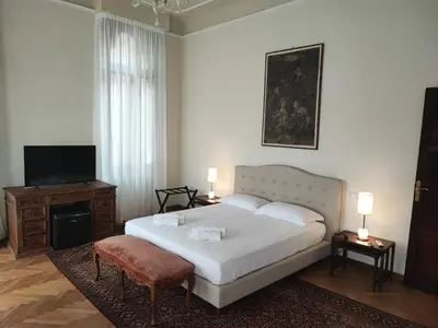 Letto o letti in una camera di Cà degli Stueri