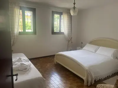 Letto o letti in una camera di Villa Rosa