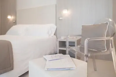 Letto o letti in una camera di Hotel Delle Nazioni