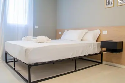 Letto o letti in una camera di Welc-ōM Tommaseo Green Building Business Free Parking