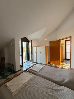 Letto o letti in una camera di Casa di Marzia