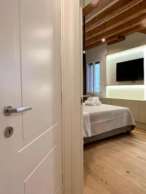 Letto o letti in una camera di Ca Ducale 2 min da Piazza San Marco e Palazzo Ducale