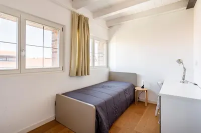 Letto o letti in una camera di WAVE'S GLASS Industrial loft in old Murano