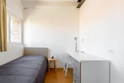 Letto o letti in una camera di WAVE'S GLASS Industrial loft in old Murano