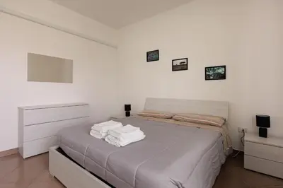 Letto o letti in una camera di Villa Serena, secret garden - 7 min Noventa Outlet