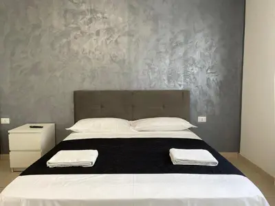 Letto o letti in una camera di Venetian Breeze