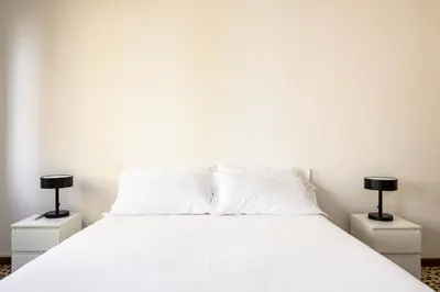 Letto o letti in una camera di Palazzina Pistor 2nd Floor by Sarlux