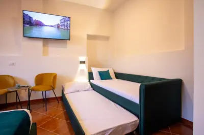 Letto o letti in una camera di Casa Bauta