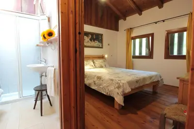 Letto o letti in una camera di Chalet Fagarè, Pool, Sauna, Prosecco Hills