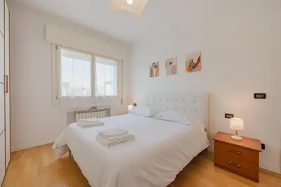 Letto o letti in una camera di Poppy's Flat - 10 min from Venice & Train Station