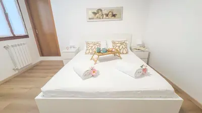 Letto o letti in una camera di La Casa di Clelia by Ca-Sa Check