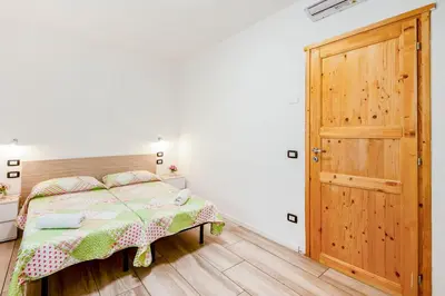 Letto o letti in una camera di Villa Trieste