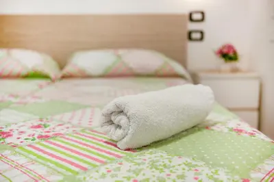 Letto o letti in una camera di Villa Trieste