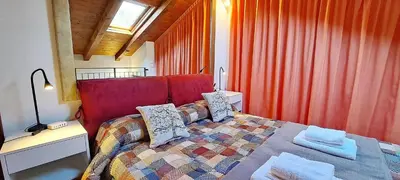 Letto o letti in una camera di open space apt - comodo a Venezia