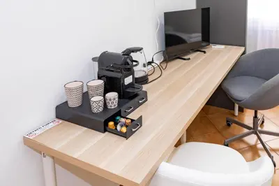 TV o dispositivi per l'intrattenimento presso Fucini Rooms Mestre Posizione strategica e comfort moderno