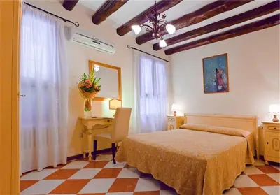 Letto o letti in una camera di Hotel Henry Venice