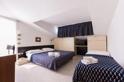 Letto o letti in una camera di Villaggio Margherita