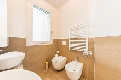 Bagno di Stylish Poolside Apartment, Jesolo-Venice
