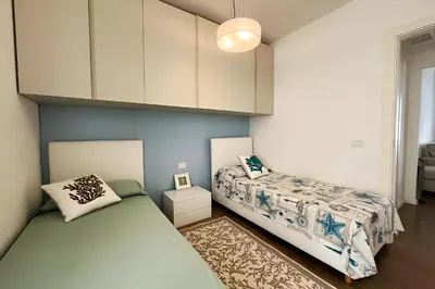 Letto o letti in una camera di Stylish Poolside Apartment, Jesolo-Venice