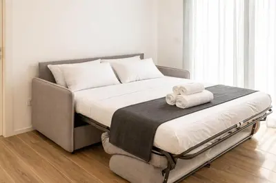 Letto o letti in una camera di Residence Fornaci - Treviso Modern Apartments Airport