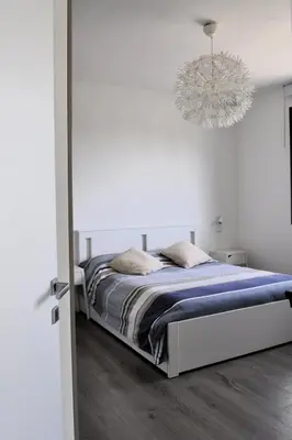Letto o letti in una camera di Giardino di Lei, appartamento Verde