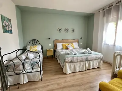 Letto o letti in una camera di Appartamento Da Deki con ampio terrazzo vista Monte Grappa