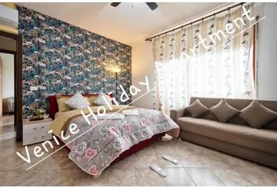 Letto o letti in una camera di Venice Holiday Apartment
