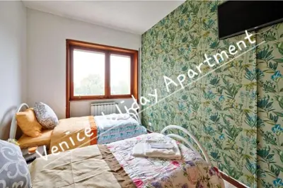 Letto o letti in una camera di Venice Holiday Apartment