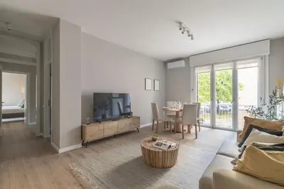 Area soggiorno di Thea Apartment by WelcHome