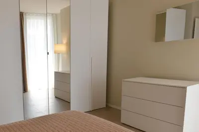 Letto o letti in una camera di Moderno 3 camere con piscina Piazza Aurora