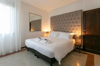 Letto o letti in una camera di Ca' Ramandolo Terrace Apartment