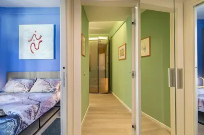 Letto o letti in una camera di Colore & Design - Apt con 2 Camere a due passi da Piazza dell' Orologio