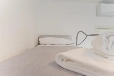 Letto o letti in una camera di Elisa Flat - 15 min from Venice & Wi-Fi
