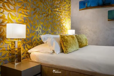 Letto o letti in una camera di Les Suites BOUTIQUE by Sleep in MURANO