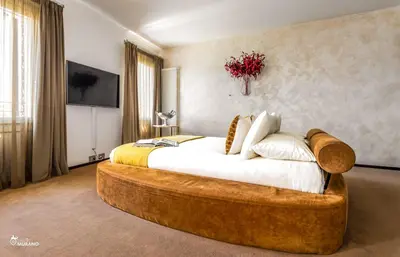 Letto o letti in una camera di Les Suites BOUTIQUE by Sleep in MURANO