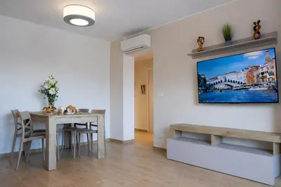 TV o dispositivi per l'intrattenimento presso Casa Tintoretto Private Free Parking Venice 15'