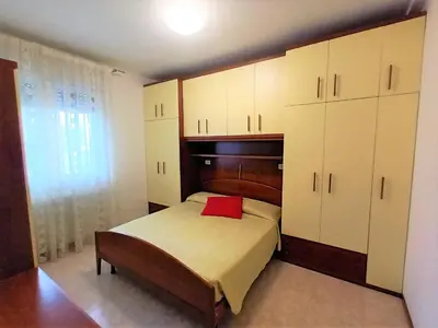 Letto o letti in una camera di Trilocale piano terra con doppi servizi Piazza Aurora