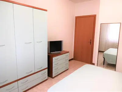 Letto o letti in una camera di Trilocale piano terra con doppi servizi Piazza Aurora