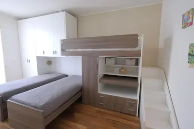 Letto o letti in una camera di Wave Village piano terra Piazza Trieste