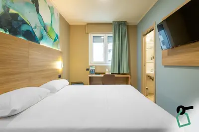 Letto o letti in una camera di Hotiday Conegliano