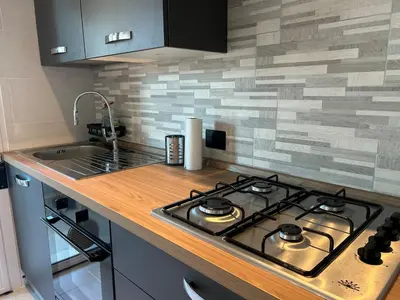 Cucina o angolo cottura di Modern apartment, terrace, AC and WiFi