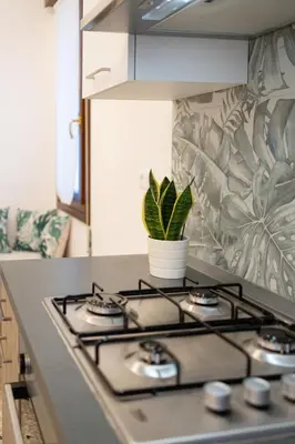 Cucina o angolo cottura di Al Pettirosso family apartment