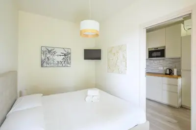 Letto o letti in una camera di GuestHost - Cozy Apt near Basilica Sant'Antonio