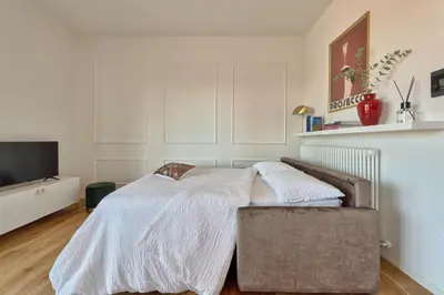 Letto o letti in una camera di Brandolini Apartment By SuitesV design, vista panoramica & parcheggio in centro città