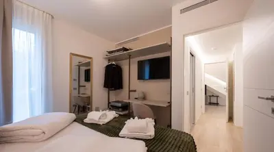 Letto o letti in una camera di Residenza Galileo -affittacamere Padova sud