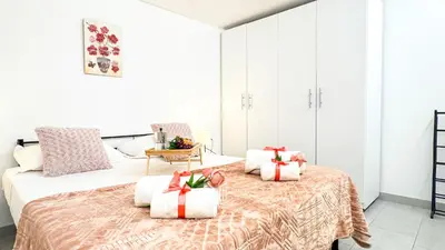 Letto o letti in una camera di Sweet Apartment by Ca-Sa Check