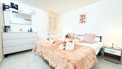 Letto o letti in una camera di Sweet Apartment by Ca-Sa Check