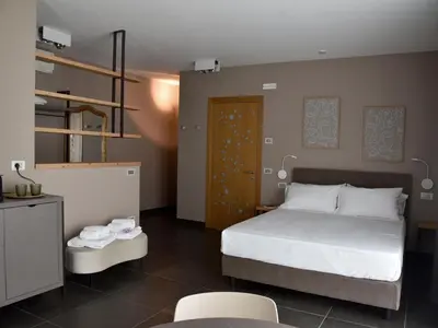 Letto o letti in una camera di Domus Natura
