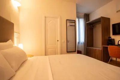 Letto o letti in una camera di Fenice Studios
